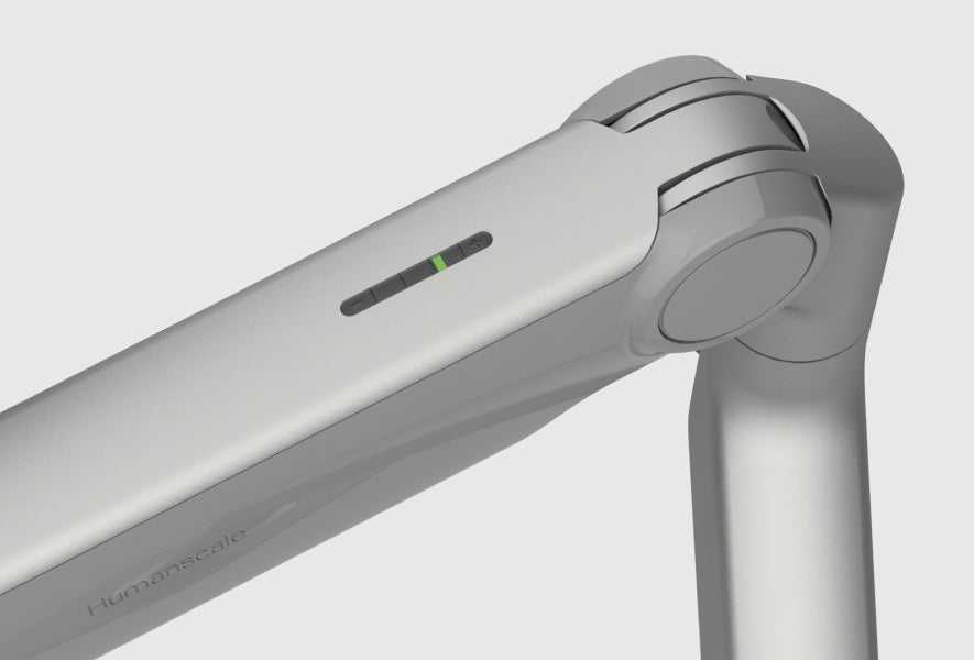 Close-up of a monitor arm on a light gray background