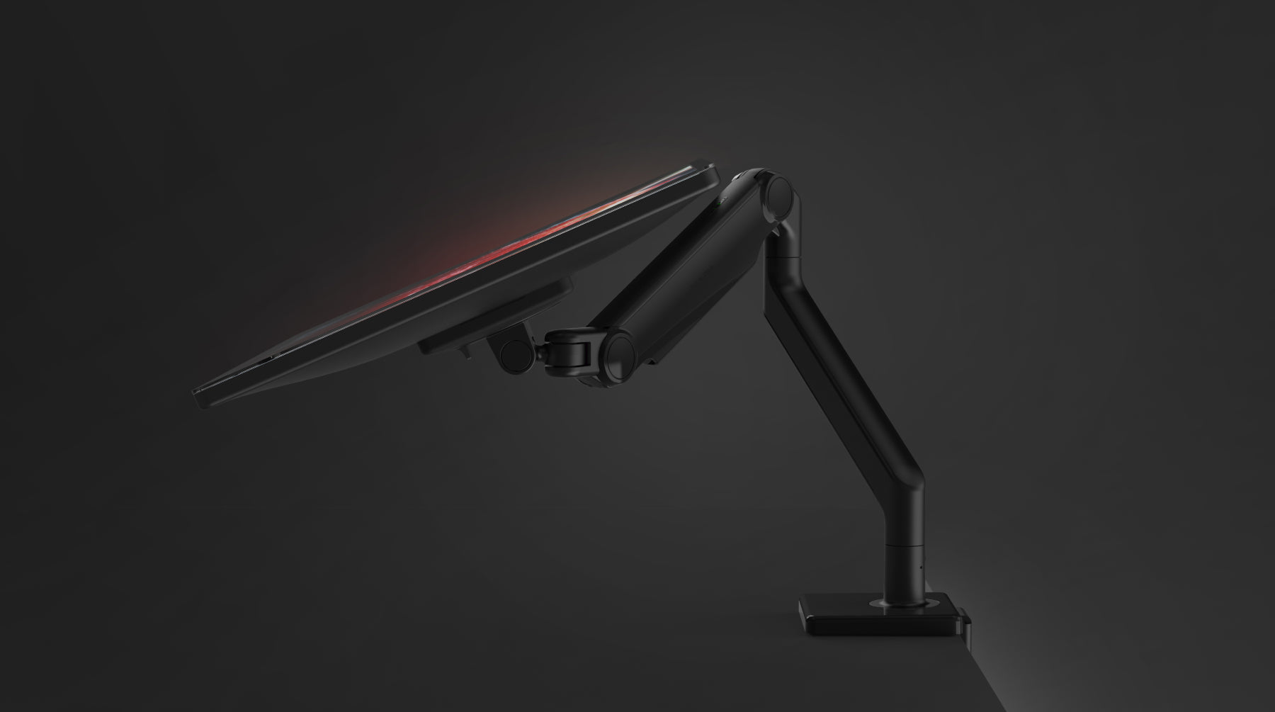 Humanscale M2.1 black adjustable monitor arm with desk clamp mount.