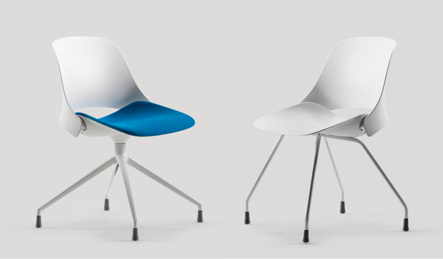 Two Humanscale Trea chairs featuring four-star and four-leg base options